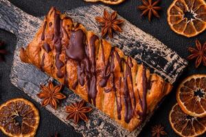 Delicious crispy sweet puff pastry with chocolate and salted caramel photo