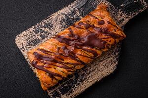 Delicious crispy sweet puff pastry with chocolate and salted caramel photo