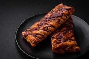 Delicious crispy sweet puff pastry with chocolate and salted caramel photo