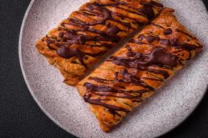 Delicious crispy sweet puff pastry with chocolate and salted caramel photo