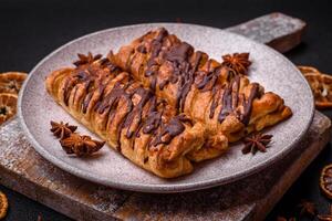 Delicious crispy sweet puff pastry with chocolate and salted caramel photo