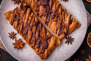 Delicious crispy sweet puff pastry with chocolate and salted caramel photo