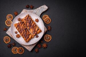 Delicious crispy sweet puff pastry with chocolate and salted caramel photo