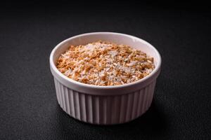 Large grains of uncooked white rice in a ceramic bowl photo