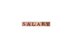 The inscription Salary made of wooden cubes on a plain background photo