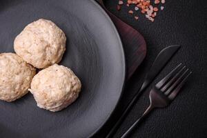 Delicious healthy steamed chicken cutlets or minced meatballs photo