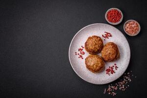 Delicious fresh fried minced fish cutlets with spices and herbs photo