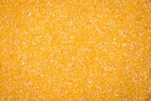 Corn grains or particles are yellow in color when raw photo