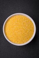 Corn grains or particles are yellow in color when raw photo