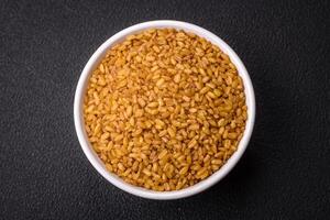 Bulgur wheat grains are yellow in color when raw photo