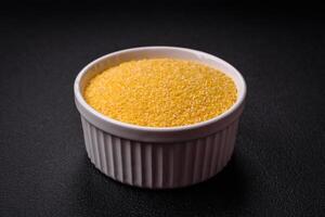 Corn grains or particles are yellow in color when raw photo