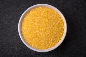 Corn grains or particles are yellow in color when raw photo