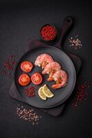 Delicious shrimp or langoustine tails boiled with salt and spices photo