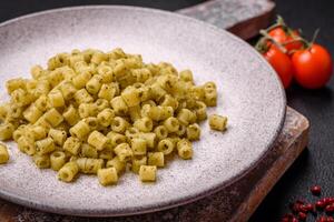 Delicious ditali pasta from durum wheat with salt and spices photo