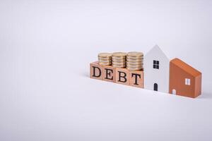 The inscription Debt inspection made of wooden cubes on a plain background photo