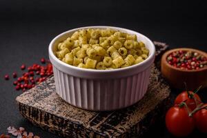 Delicious ditali pasta from durum wheat with salt and spices photo