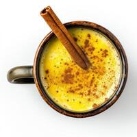 AI generated A ceramic mug of golden milk turmeric latte with a cinnamon stick top view isolated on a transparent background photo