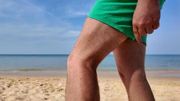 Summer Bliss, Man Relaxing on Beach, beach fly bites, beach flea bites photo
