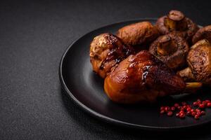 Delicious grilled chicken legs with spices and herbs in teriyaki sauce photo