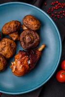 Delicious grilled chicken legs with spices and herbs in teriyaki sauce photo