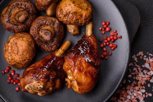 Delicious grilled chicken legs with spices and herbs in teriyaki sauce photo