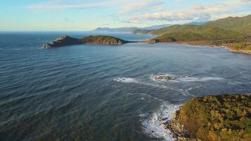 Sea of Japan surrounded by rocky terrain Sea of Japan haven of untouched natural beauty. Sea of Japan rich with marine life and forested coasts Realm where tranquility and majesty reign. video