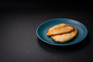 Delicious battered chicken breast chops with salt, spices and herbs photo
