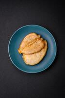 Delicious battered chicken breast chops with salt, spices and herbs photo