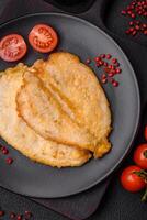 Delicious battered chicken breast chops with salt, spices and herbs photo