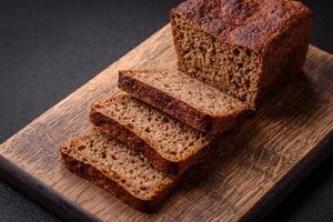 Delicious fresh crispy brown bread with seeds and grains photo