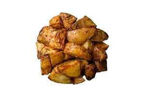 Delicious crispy fried potato wedges with salt, spices and herbs photo