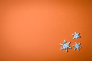 Beautiful winter snowflakes on a plain background with copy space photo