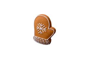 Beautiful delicious sweet winter Christmas gingerbread cookies on a bronze textured background photo