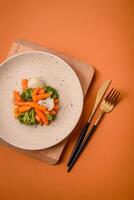 Delicious fresh vegetables broccoli, cauliflower, carrots steamed with salt and spices photo