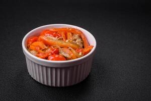 Delicious fresh stew with chicken or turkey with slices of sweet pepper and carrots photo