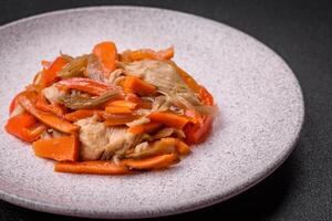 Delicious fresh stew with chicken or turkey with slices of sweet pepper and carrots photo