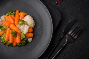 Delicious fresh vegetables broccoli, cauliflower, carrots steamed with salt and spices photo