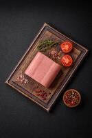 Delicious canned pink ham with salt, spices and herbs photo