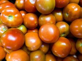 Top view of tomatoes  texture background with copy space photo