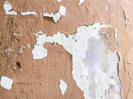 Dark concrete texture with a stucco finish on a white background. photo