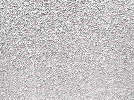 The abstract details on the cement wall make it a compelling design element. photo