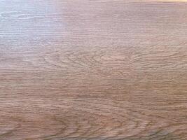 Teak wood with a rough and textured appearance, providing a raw and organic feel to designs. photo