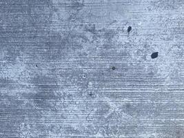 A retro wallpaper featuring a dark and scratched concrete texture.  copy space for design photo