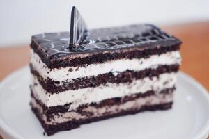 Delicious chocolate cake on a white plate photo