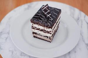 Delicious chocolate cake on a white plate photo