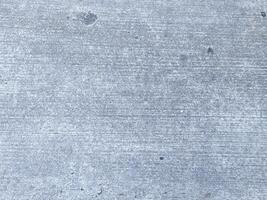 An antique concrete wall, weathered and worn, adding character to any project. photo