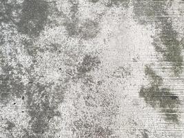 The rough and abstract surface of a concrete wall, perfect for a grunge design. photo