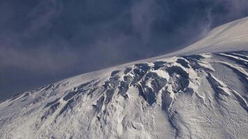 Sunset over a crevassed glacier high in the mountains video