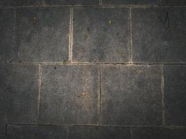 A black texture background featuring an abstract dark pattern, providing a visually striking design. photo