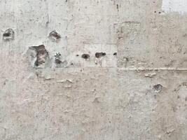 Dirty and ancient concrete wall with a crumpled paper effect. photo